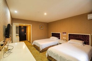 A hotel room with two beds, a desk, a television, and a door leading to a bathroom. - Qiha Hotel (Xiangshan North Gate Qingcao Alley) (Xiangshan)
