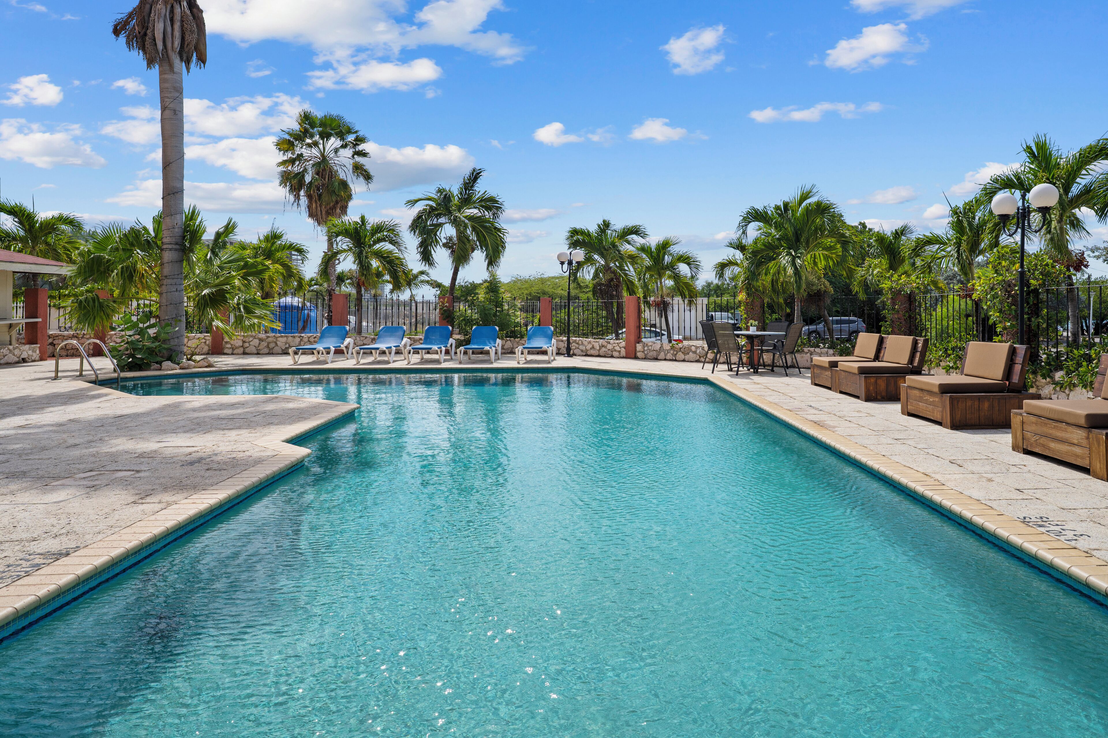 Outdoor pool, open 8:00 AM to 8:00 PM, pool umbrellas, pool loungers