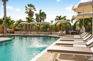 Outdoor pool, open 8:00 AM to 8:00 PM, pool umbrellas, sun loungers