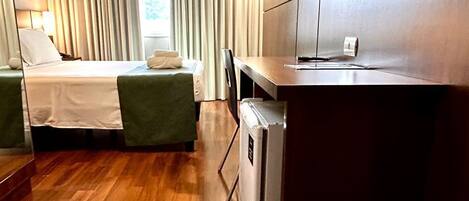 Deluxe Suite, City View | Desk, laptop workspace, blackout drapes, soundproofing