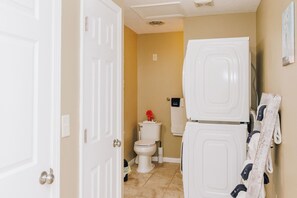 A bathroom with a toilet, a white cabinet, and a towel rack. - Mountaintop Cottage  (Stanton)