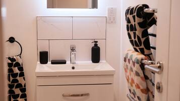 Shower, towels, soap, toilet paper