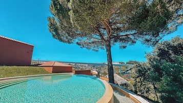Outdoor pool, open 9:00 AM to 8:00 PM, pool umbrellas, pool loungers
