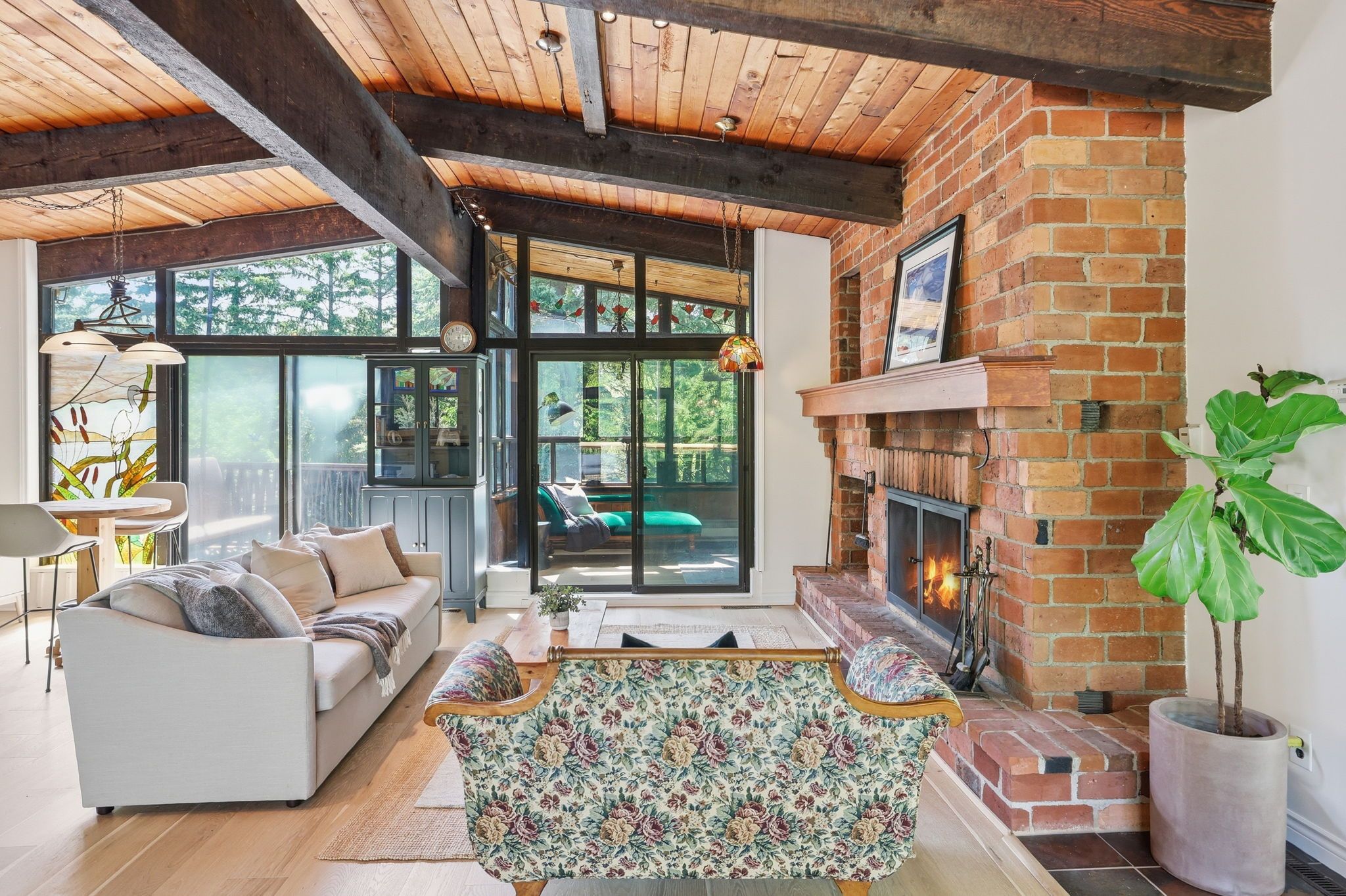 A cozy living room with a fireplace, a sofa, and a coffee table.