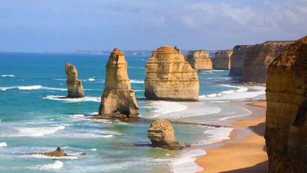 A coastal landscape with prominent rock formations and a sandy beach. - Ocean View Skenes Creek Beach House (Skenes Creek)