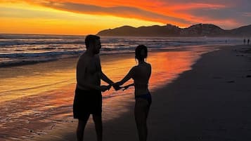 Beach nearby, white sand, beach towels