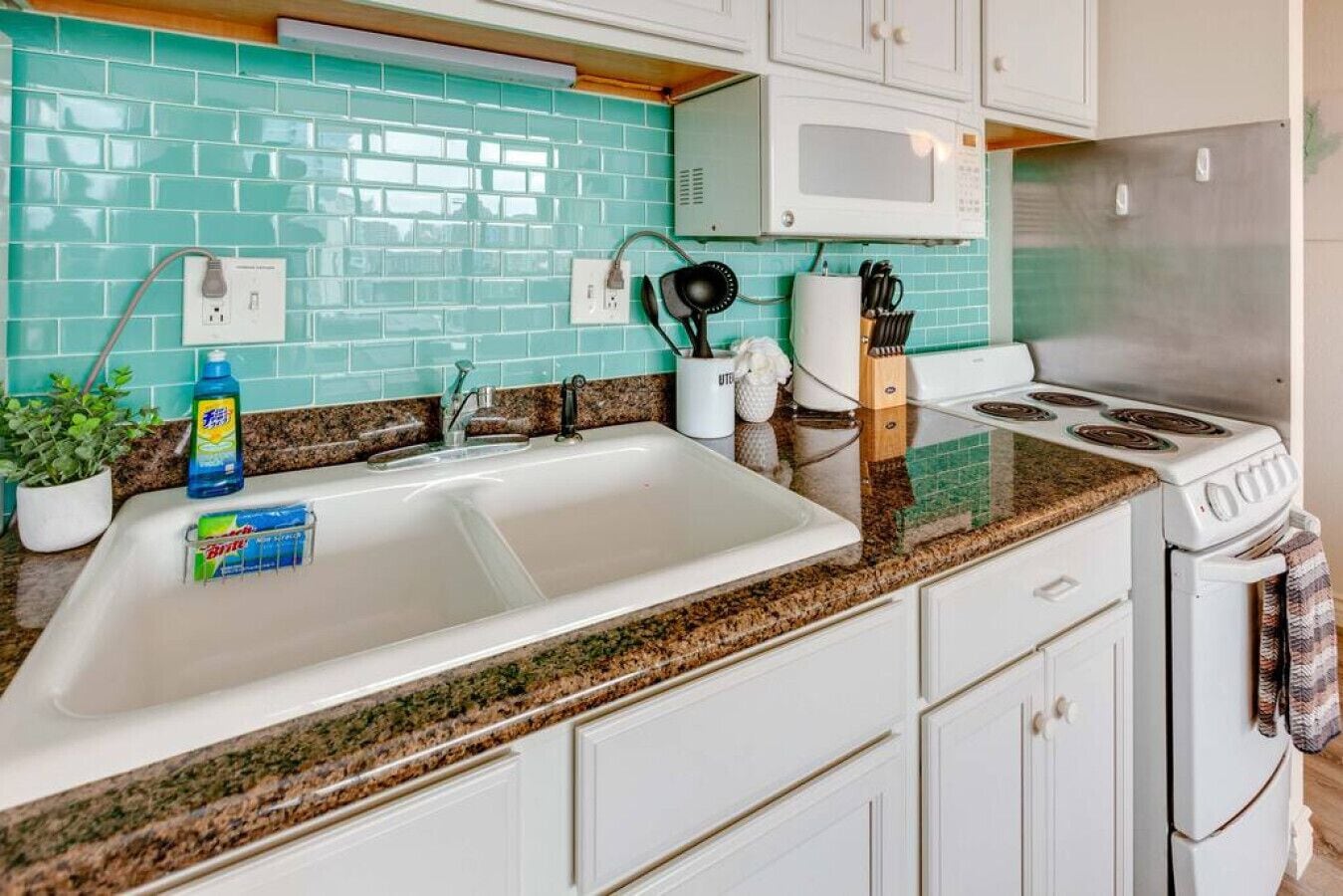 Fridge, microwave, coffee/tea maker, cookware/dishes/utensils