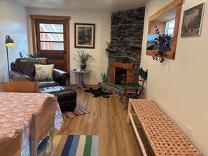 Smart TV, fireplace, books, printers