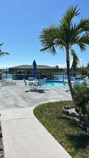 Outdoor pool, a heated pool - Beautifully furnished Treasure Cay 2bd 2bth condo with 36’ boat slip! (Treasure Cay)