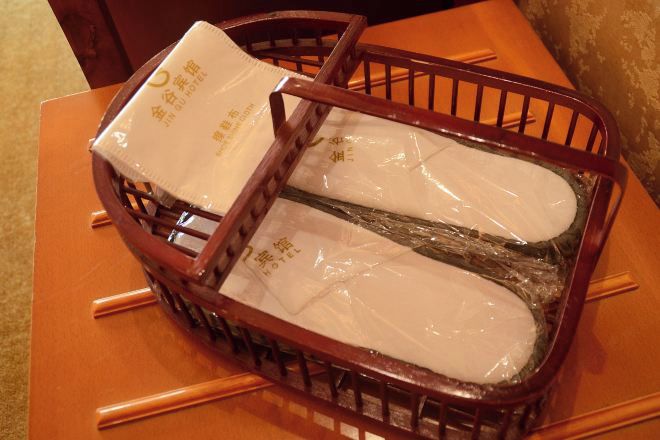 A wooden chair with a plastic bag on it.
