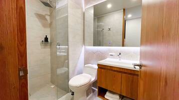 Shower, rainfall showerhead, hair dryer, towels