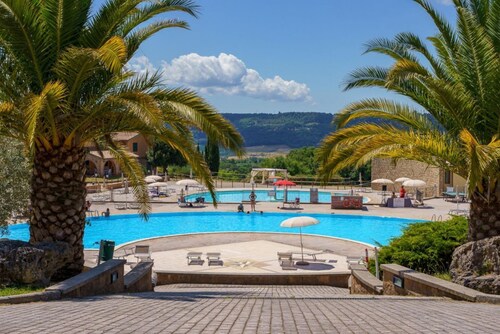 Nice three-room apartment in typically Tuscan style on the ground or first floor of approximately 50 m2 located in the area around the swimming pools.It is composed of a living room with dining area, flat-screen television and sofa bed, kitchenette equip