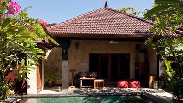Deluxe Villa, 1 Bedroom, Pool View, Garden Area | 1 bedroom, in-room safe, desk, laptop workspace