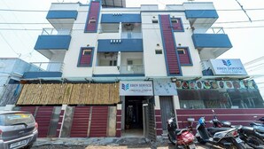 A multi-story building with a sign for 'Eben Service Apartments'. - Eben Service Apartment  (Chennai)