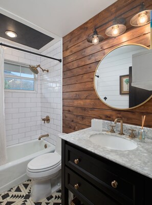 Shower, hair dryer, towels, shampoo