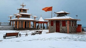 A traditional building with a tiered roof and a flagpole. - Burans Breeze A Home Away From Home (Dhanaulti)