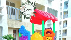 Children's play area - outdoor - Davao Condo 2BR Unit Pool Wi-Fi Netflix (Davao)