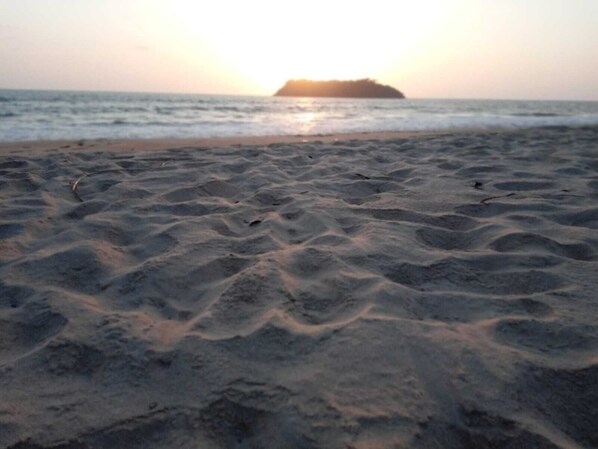 A beach with sand and water. - JRN Island Beach Stay Resort (Honavar)