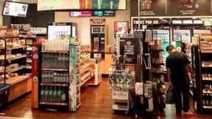 A 7-Eleven convenience store with shelves stocked with various products, a beverage cooler, and a sign advertising 'Liquid Hugs for Your Brain'. - The Retreat Sunriseview Cameron highland (Brinchang)
