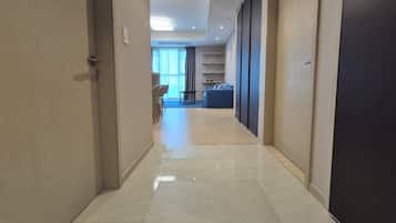 Residence connecting suite room | Living area | 96-cm TV with cable channels, printers