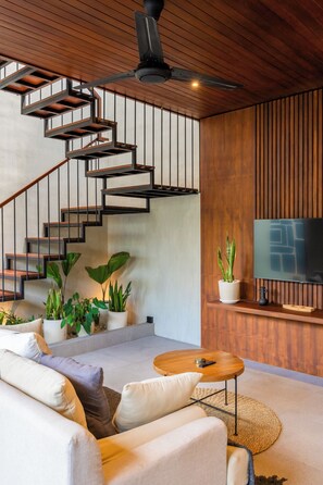 Villa | Living area | 35-inch flat-screen TV with cable channels