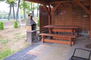 Outdoor dining - Holiday Home With a Terrace, Right on the Lake (Ryn)