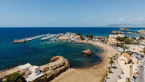 A coastal town with a marina, sandy beach, and clear blue sea. - Mazarron Coastal Apartment for 3 (Mazarrón)