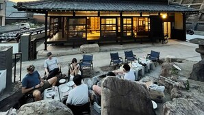 A traditional Korean restaurant with outdoor seating and a tiled roof. - Hayase House (Kure)