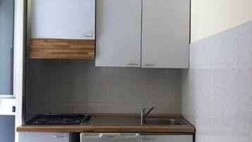 Basic Quadruple Room, Kitchenette | Private kitchenette