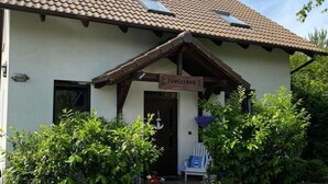 A house with a sign reading "Pawelkon". - Holiday Home in Kolczewo Near Wild Beach (gmina Wolin)