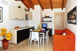 Apartment | Private kitchen - Club Village & Hotel Spiaggia Romea, Lido Delle Nazioni (Comacchio)