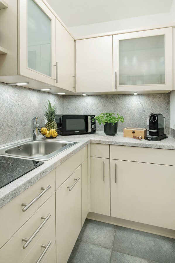 Fridge, microwave, coffee/tea maker, toaster