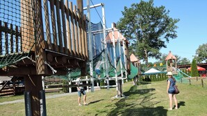 A playground with climbing structures and a rope net. - Holiday House in Dziwnowek Near Sea and Lake (Kamien Pomorski)