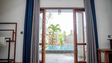 Deluxe Double Room, Pool View | Desk, laptop workspace, iron/ironing board, free WiFi