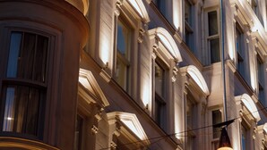 A multi-story building with classical architectural features, including ornate window frames and a curved balcony. - Casa Foscolo Hotel, Istanbul, a Member of Design Hotels (Istanbul)