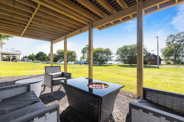 Enjoy even more room to relax under the covered patio, complete with a cozy propane fire table for evening gatherings.