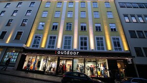 A multi-story building with a storefront labeled "outdoor". - Forenom Serviced Apartments Bergen City (Bergen)