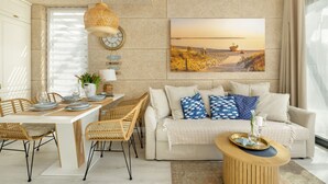 A modern living room with a dining area, featuring a sofa set, a coffee table, and a dining table with chairs. - Comfortable House With, Whirlpool Bathtub Wrzosowo (Kamien Pomorski)