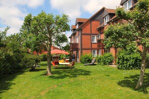 Enjoy a family-friendly living environment with a beautifully maintained garden and patio area.