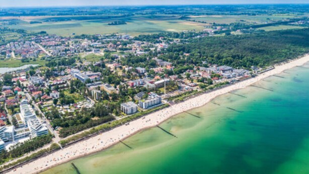 An aerial view of a coastal town with a beach, buildings, and green fields. - Holiday House Near the Sea, Swimming Pool, Mielno (Mielno)