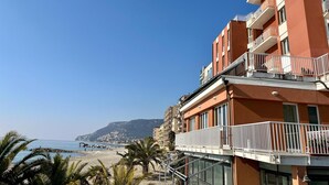 A coastal building with balconies overlooking a beach. - Pietra Ligure Beach Residence for 4 (Pietra Ligure)
