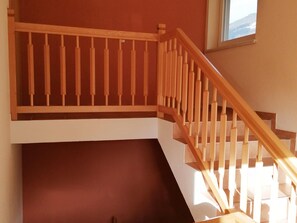A wooden staircase with a handrail, leading to a lower level. - Holiday on an Organic Farm in Hart im Zillertal (Hart im Zillertal)