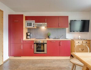 Appartement | Privékeuken | Een kinderstoel