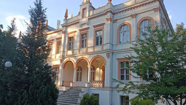 A large, historic building with multiple arches and a grand staircase leading to the entrance. - Landhaus in Vollerwiek (Vollerwiek)