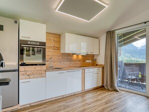 Apartment | Private kitchen | Electric kettle, highchair