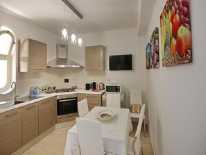 Apartamento | Cozinha privada | Cadeirão de bebê