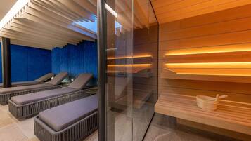 Relax in a serene space with lounge chairs, a glass partition, and a wooden shelf.