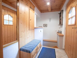 A wooden cabin with a bench, a small window, and a door. - Chalet in Austria Near Ski Lift & Forest (Wald im Pinzgau)
