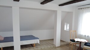 A room with a bed, a chair, and a window. - Cottage in Stepnica Near Szczecin Lagoon (Stepnica)