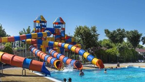A water park with a large pool and multiple slides. - Bungalow in Caorle With Garden Furniture (Caorle)